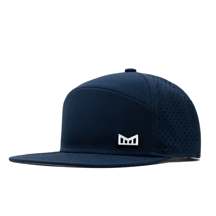 The angled view of the Melin Horizon Fit Treches Icon Hydro hat in dark blue