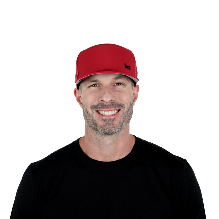 The model-image of the Melin Horizon Fit Trenches Icon Hydro hat in Red