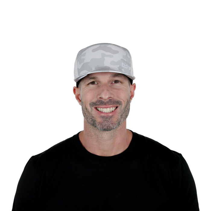 The model-image of the Melin Horizon Fit Trenches Icon Hydro hat in Snow Camo