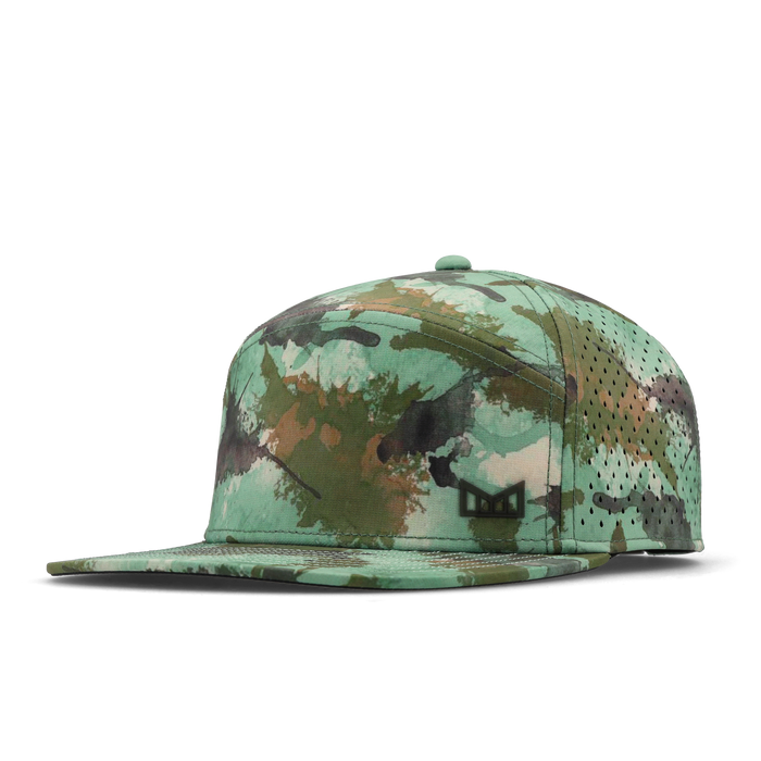 The angled view of the melin Horizon Fit Trenches Icon Hydro hat in watercolor camo
