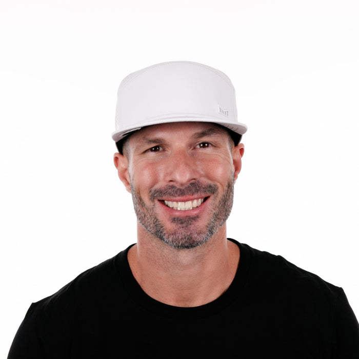 The model-image of the Melin Horizon Fit Trenches Icon Hydro hat in White