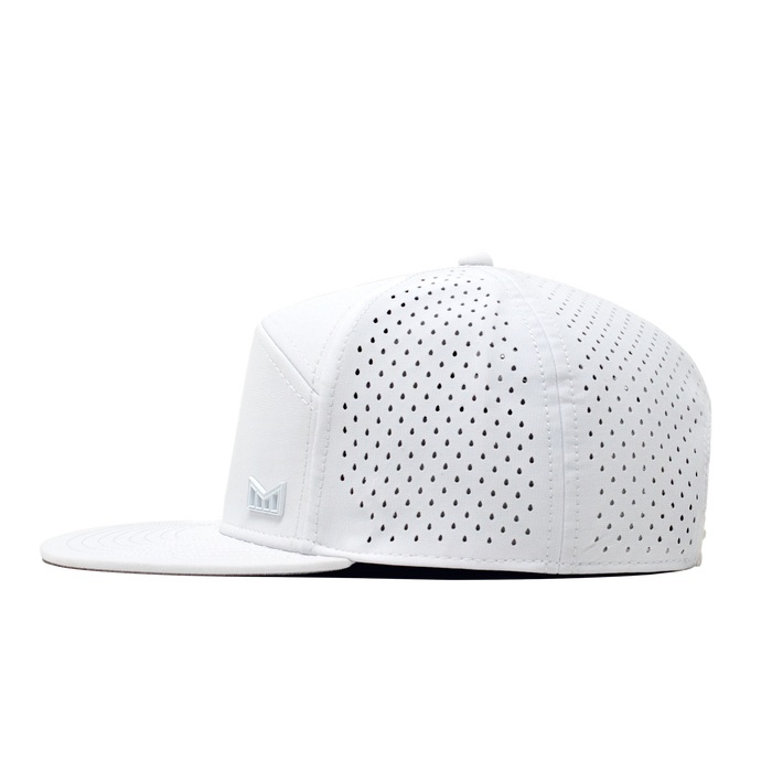 The side view of the Melin Horizon Fit Trenches Icon Hydro hat in white
