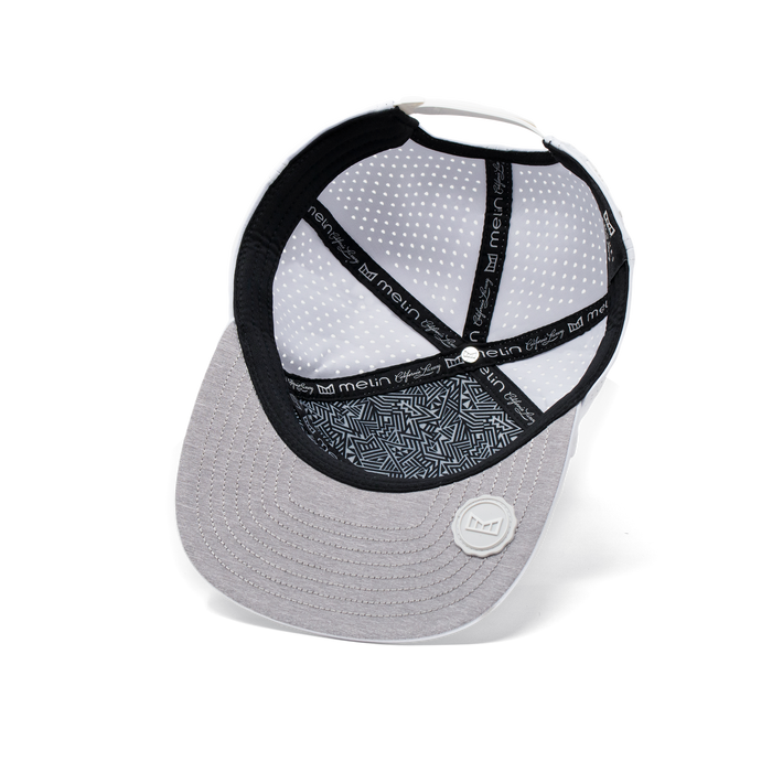 The inside view of the Melin Horizon Fit Trenches Icon Hydro hat in white