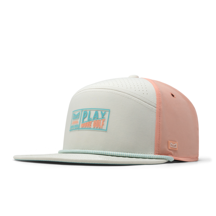 The front, angled view of the melin Trenches Links Hydro  Horizon Fit in  Peach Nectar