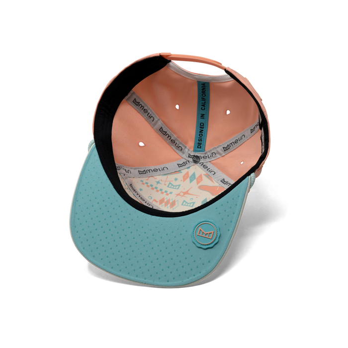 The inside view of the melin Trenches Links Hydro  Horizon Fit in  Peach Nectar