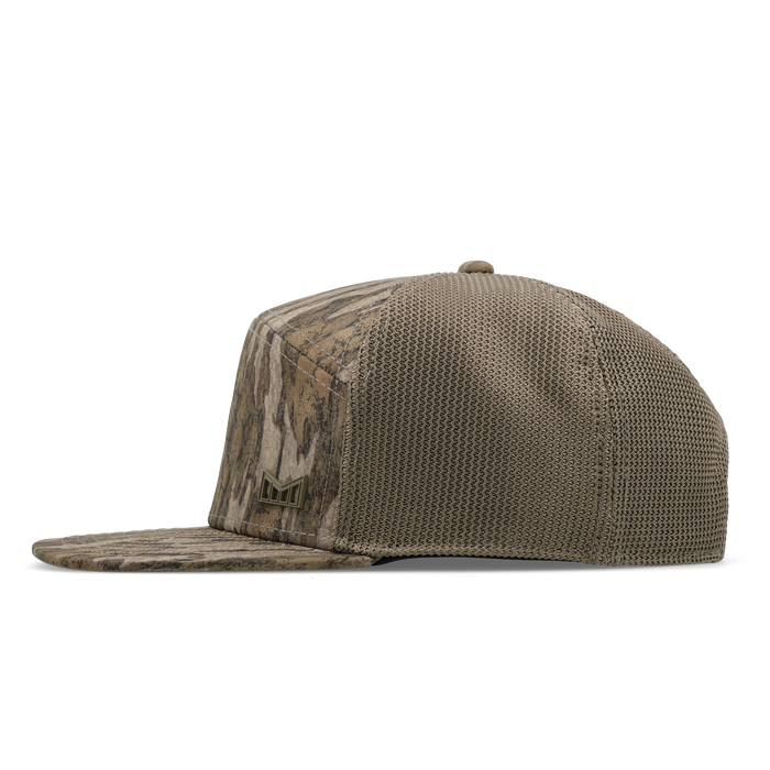 The side view of the melin Horizon Fit Trenches Mossy Oak Hydro hat in Bottomland