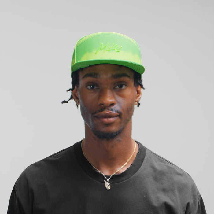 The model-image view of the melin Horizon Fit Trenches Neon Tie Dye Hydro Hat in Slime